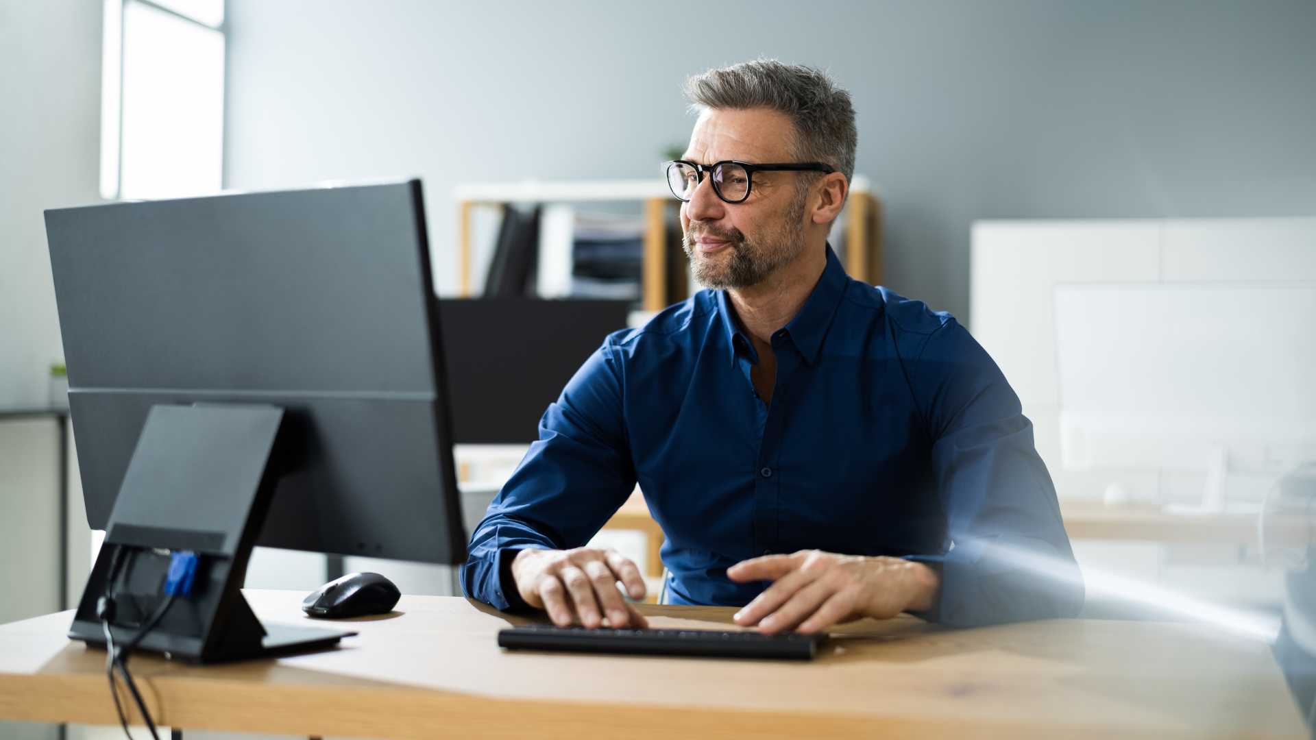 Man on computer researching